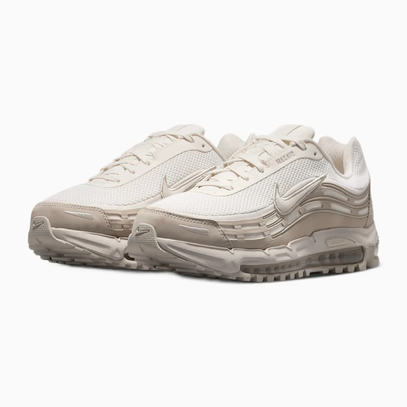 Pair of beige Nike Air Max sneakers with mesh upper and visible air cushioning in the sole.