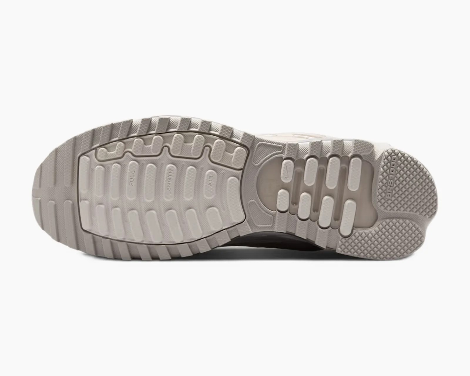 Light gray rubber outsole of a sneaker with textured grip and visible air cushioning.