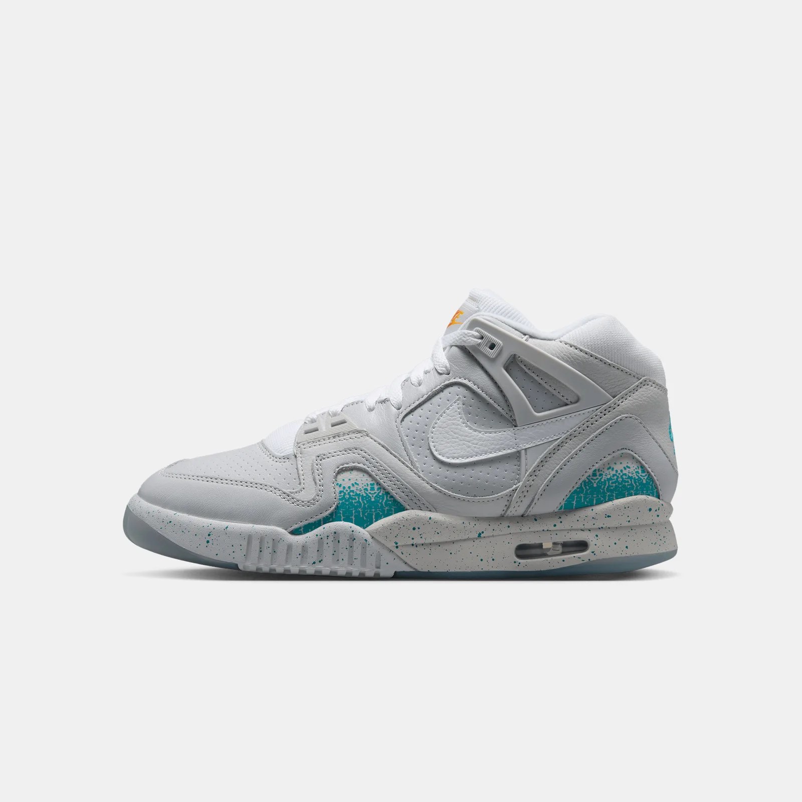 White Nike Air Trainer SC High sneaker with teal speckled accents and orange logo on tongue.