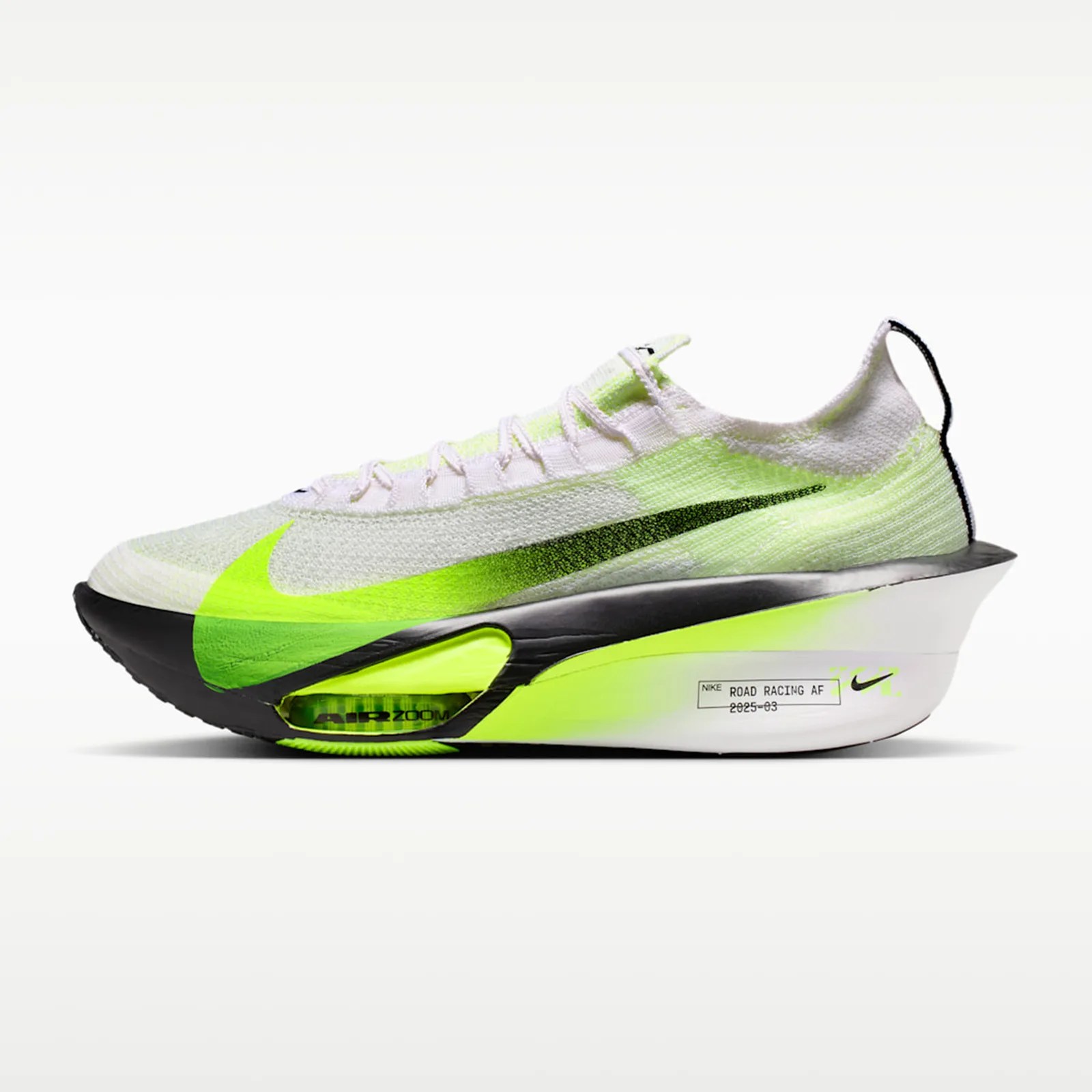White and neon green Nike Air Zoom running shoe with black sole and large swoosh logo.