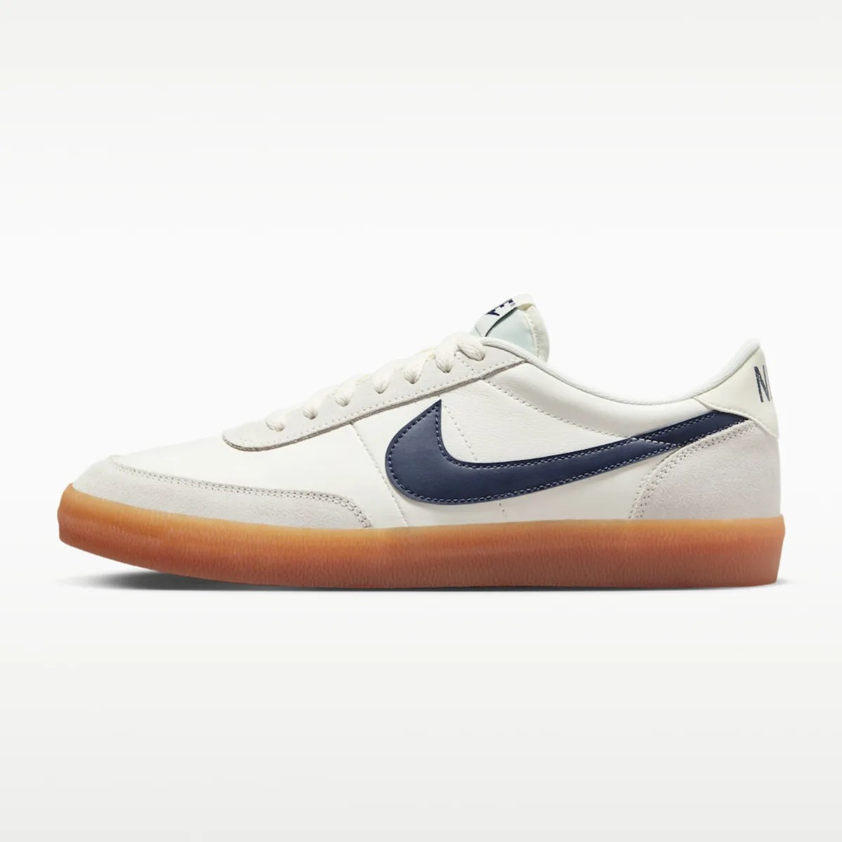 White low-top Nike sneaker with navy blue swoosh and gum rubber sole.