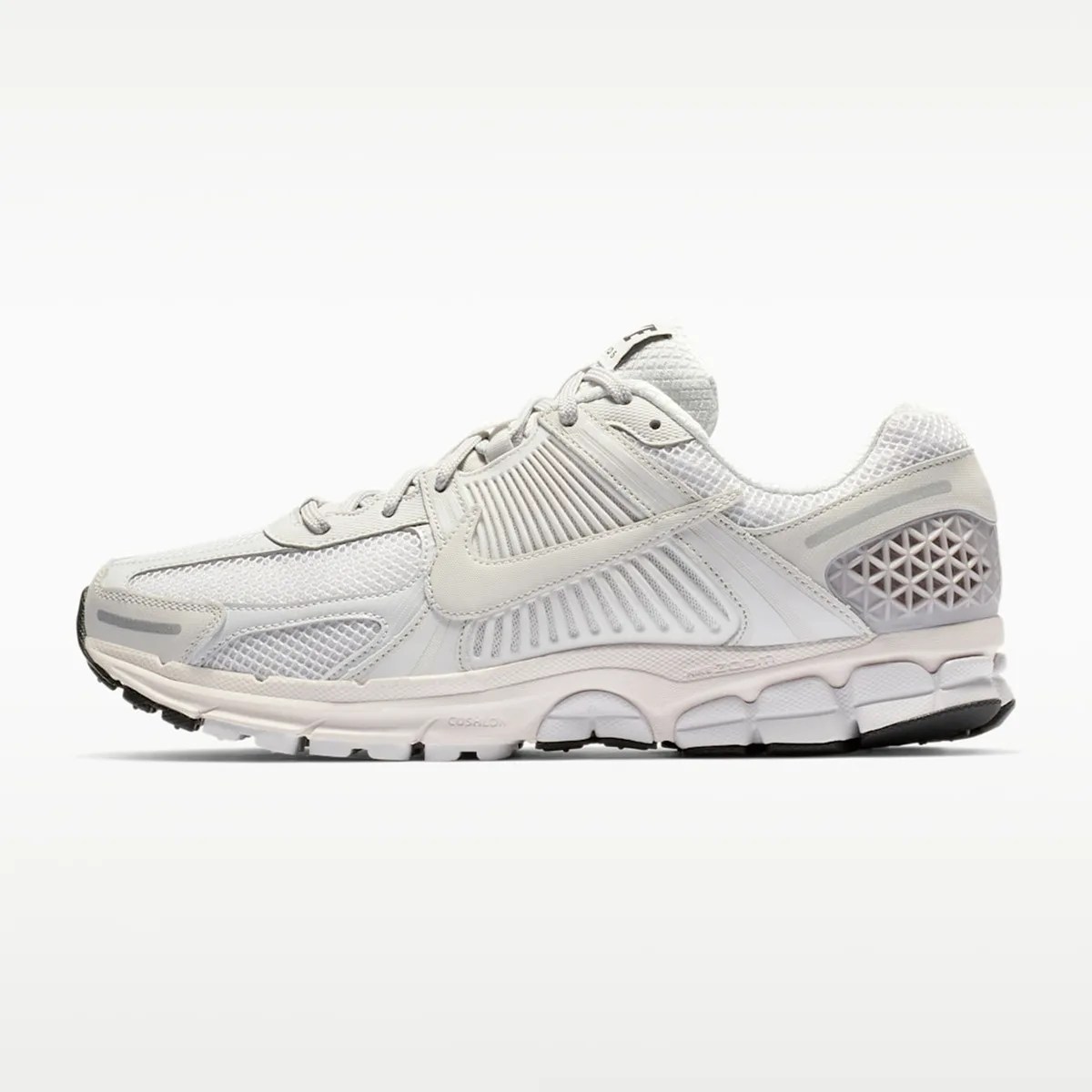 Light gray Nike running shoe with mesh and synthetic upper, cushioned sole, and black outsole accents.