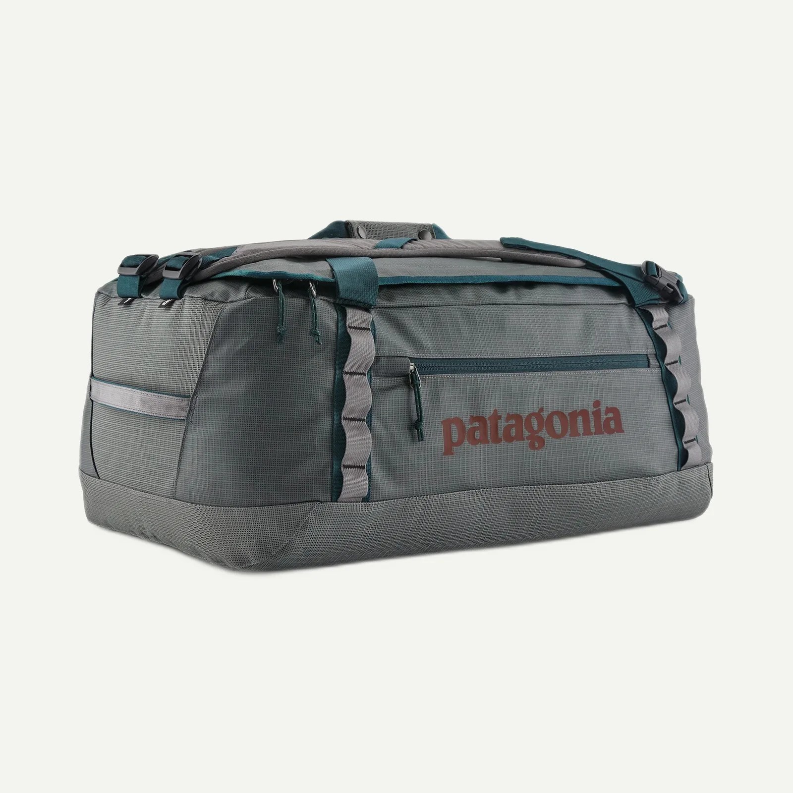 Gray and teal Patagonia duffel bag with front zipper pocket and logo on side.