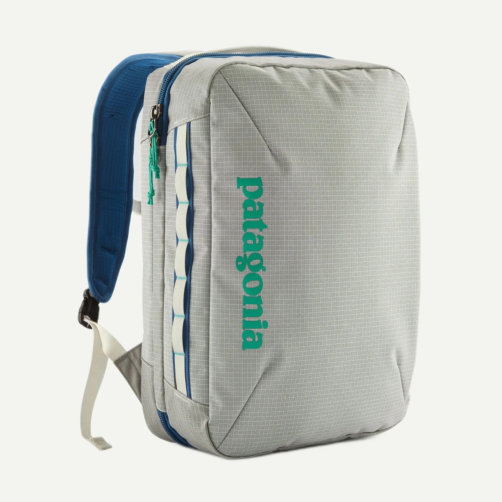 Light gray Patagonia backpack with blue padded straps and teal logo on the front panel.