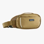 Tan Patagonia waist pack with black logo patch and adjustable strap with buckle.