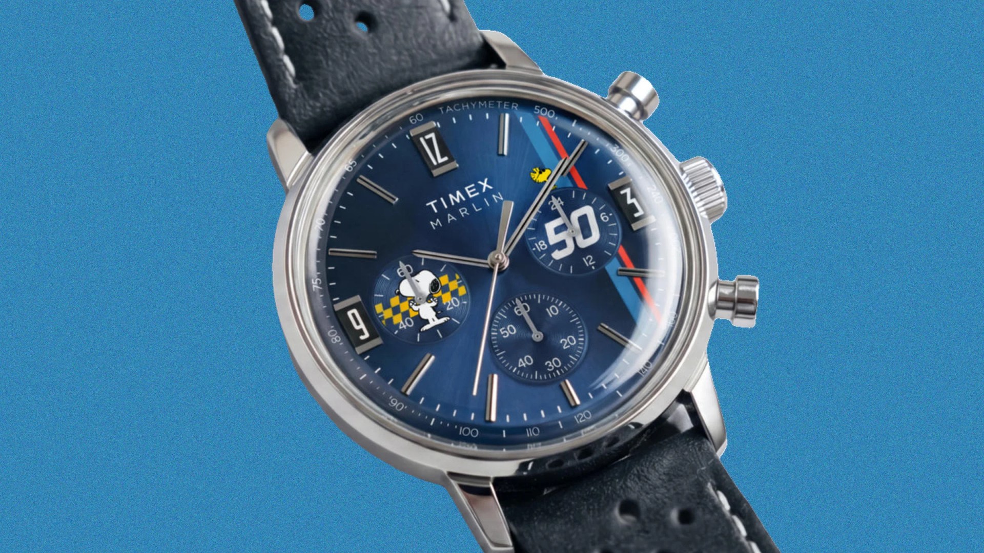 Timex Marlin chronograph watch with blue dial featuring Snoopy and Woodstock illustrations and black leather strap.