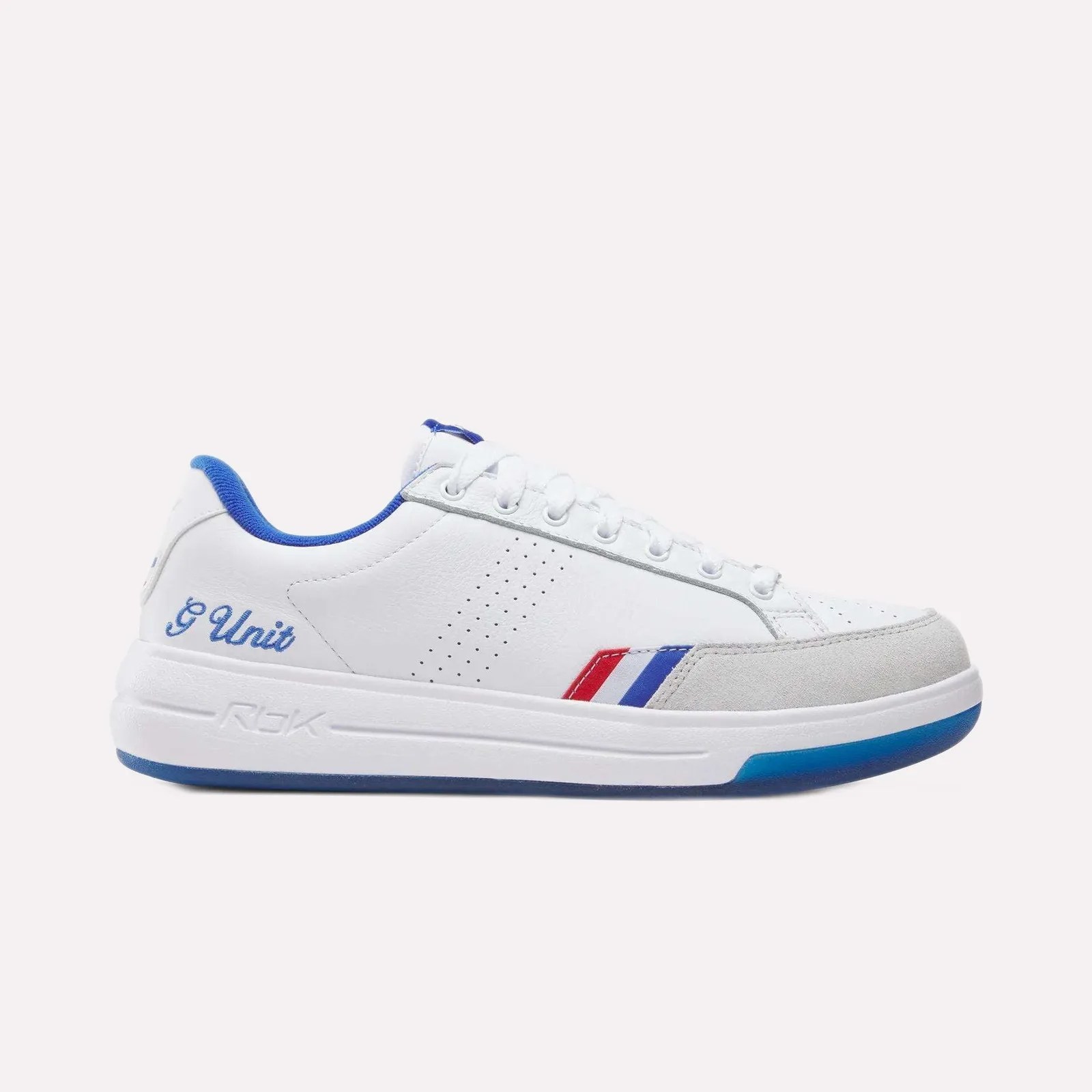 White low-top sneaker with blue lining, red and blue stripes, gray suede toe cap, and "g Unit" embroidered on the heel.