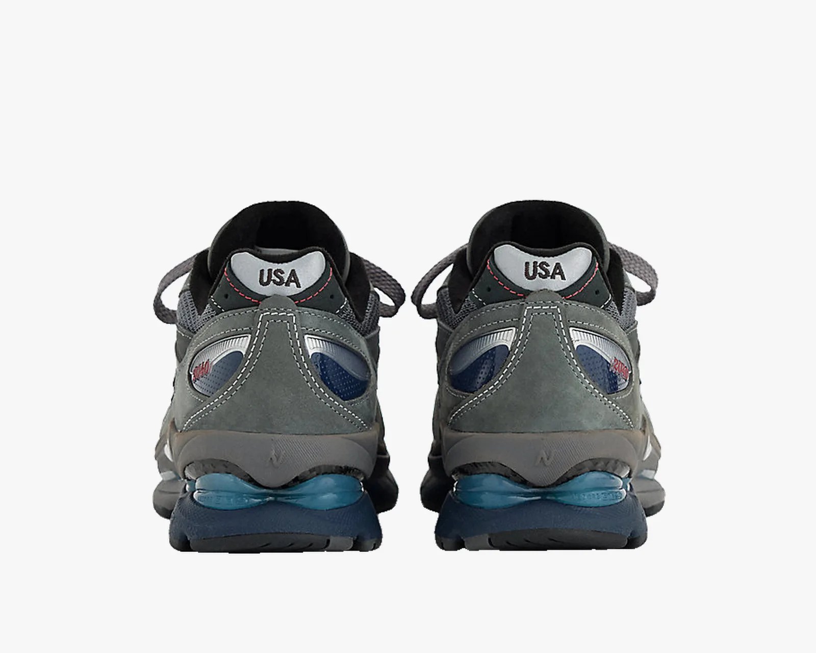 Pair of gray and blue athletic shoes with "USA" text on the heel tab, viewed from the back.