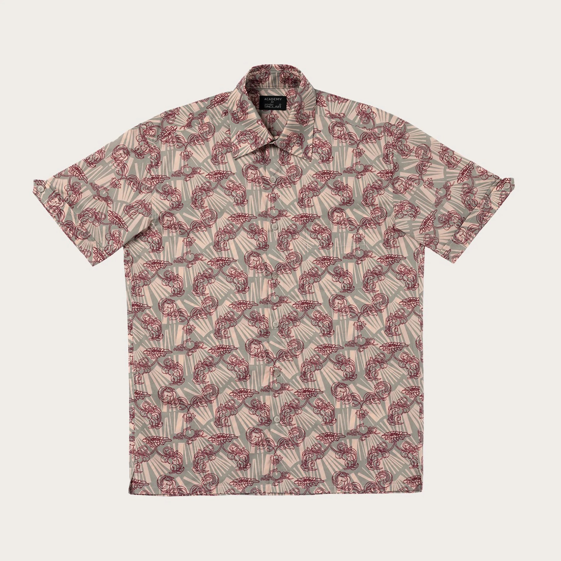 Short-sleeve button-up shirt with beige and gray geometric background and red ornate floral pattern.
