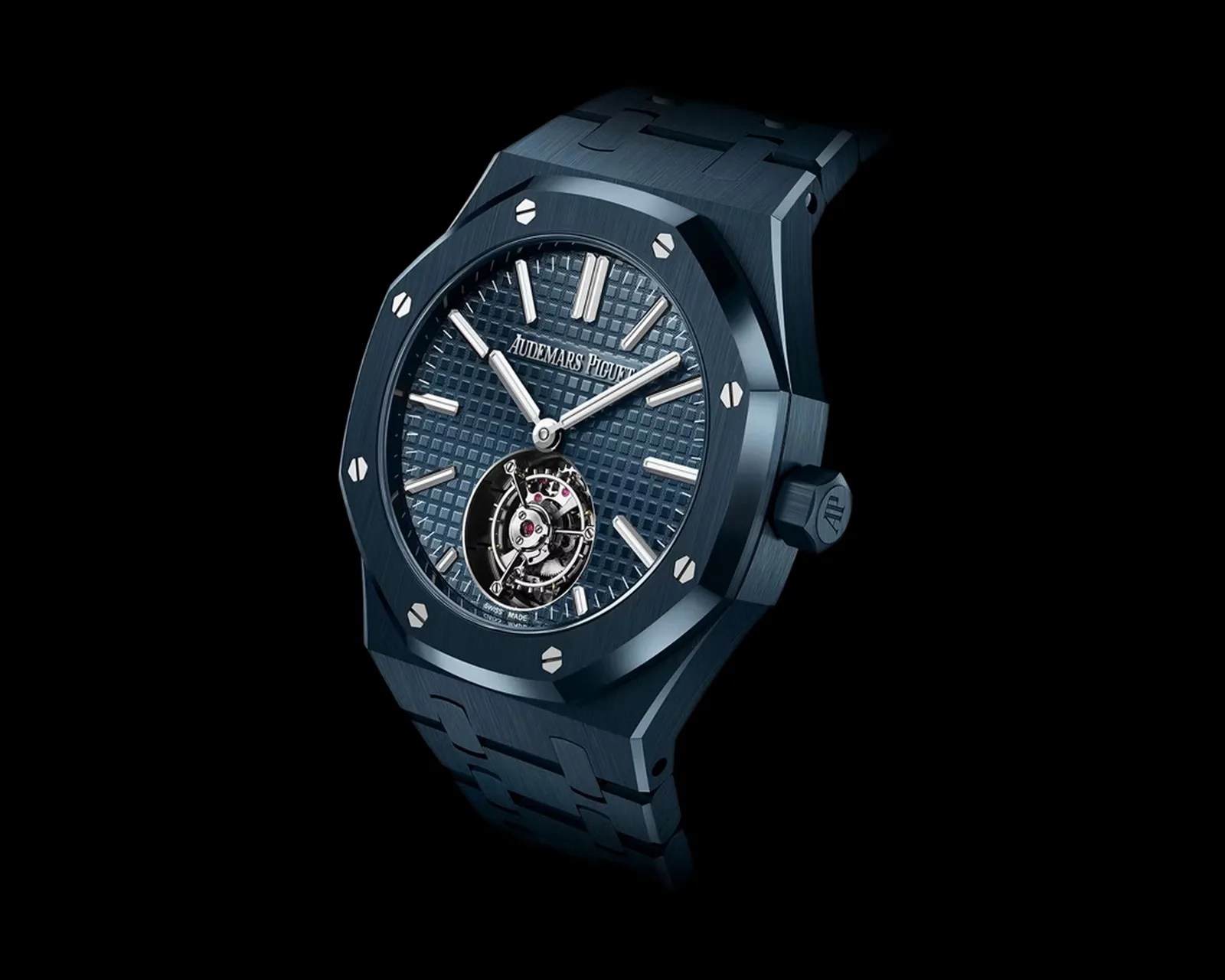 Blue Audemars Piguet Royal Oak watch with a textured dial, silver hour markers, and visible tourbillon mechanism.