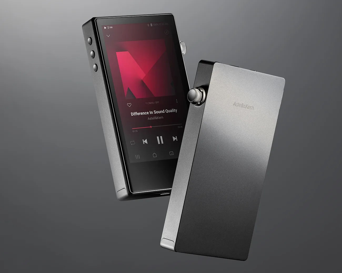 Two sleek, rectangular digital music players in dark gray, one showing a touchscreen with music controls and the other showing a metallic back with a volume knob.
