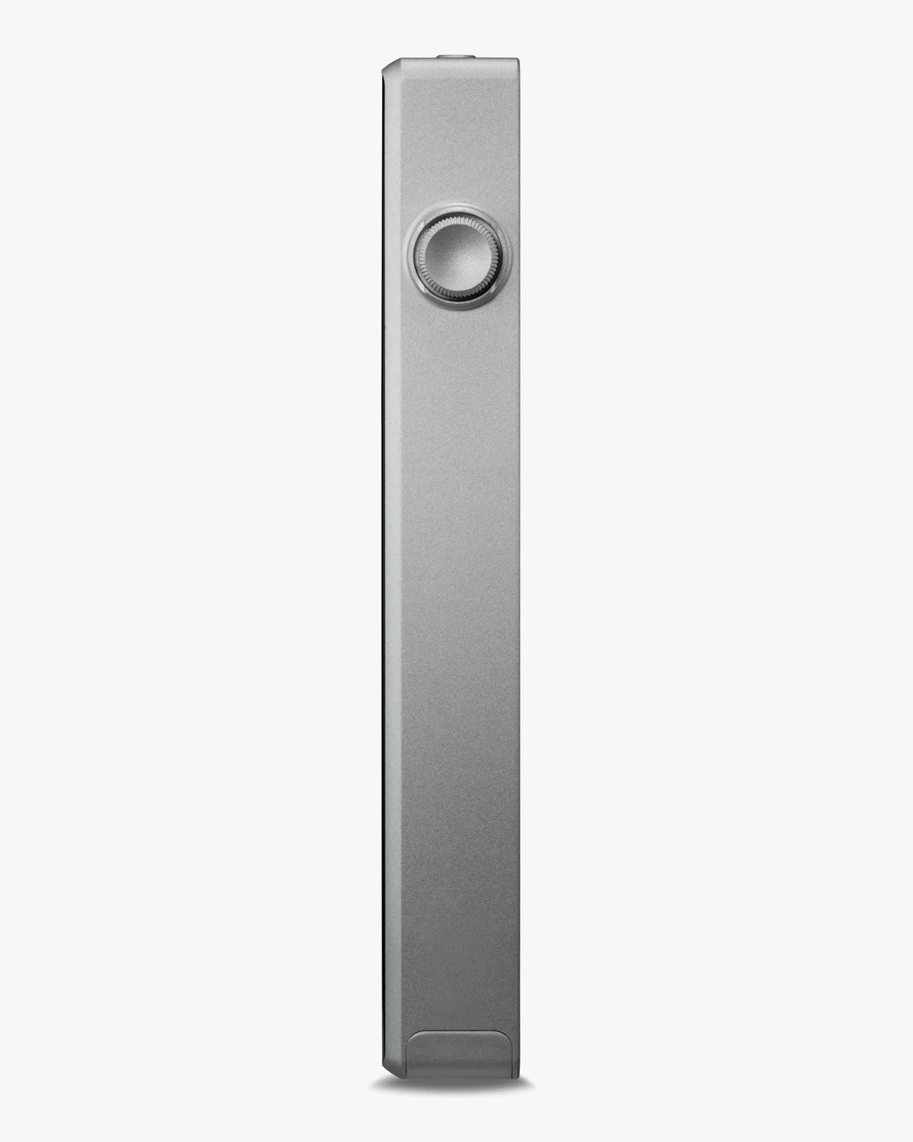 Slim silver rectangular device with a circular dial on one side against a white background.