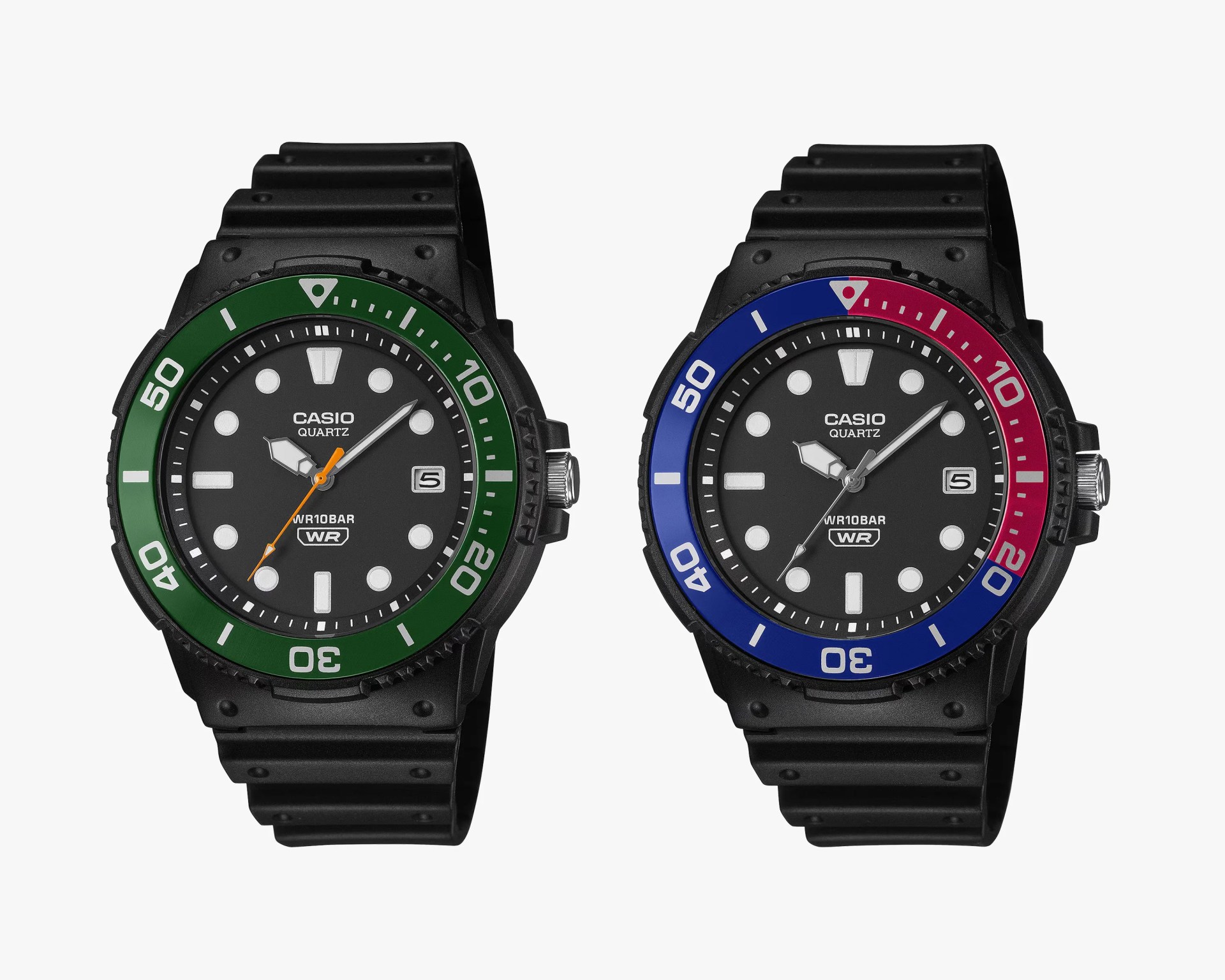 Two Casio Quartz wristwatches with black faces and bands, one with a green bezel and the other with a blue and red bezel.
