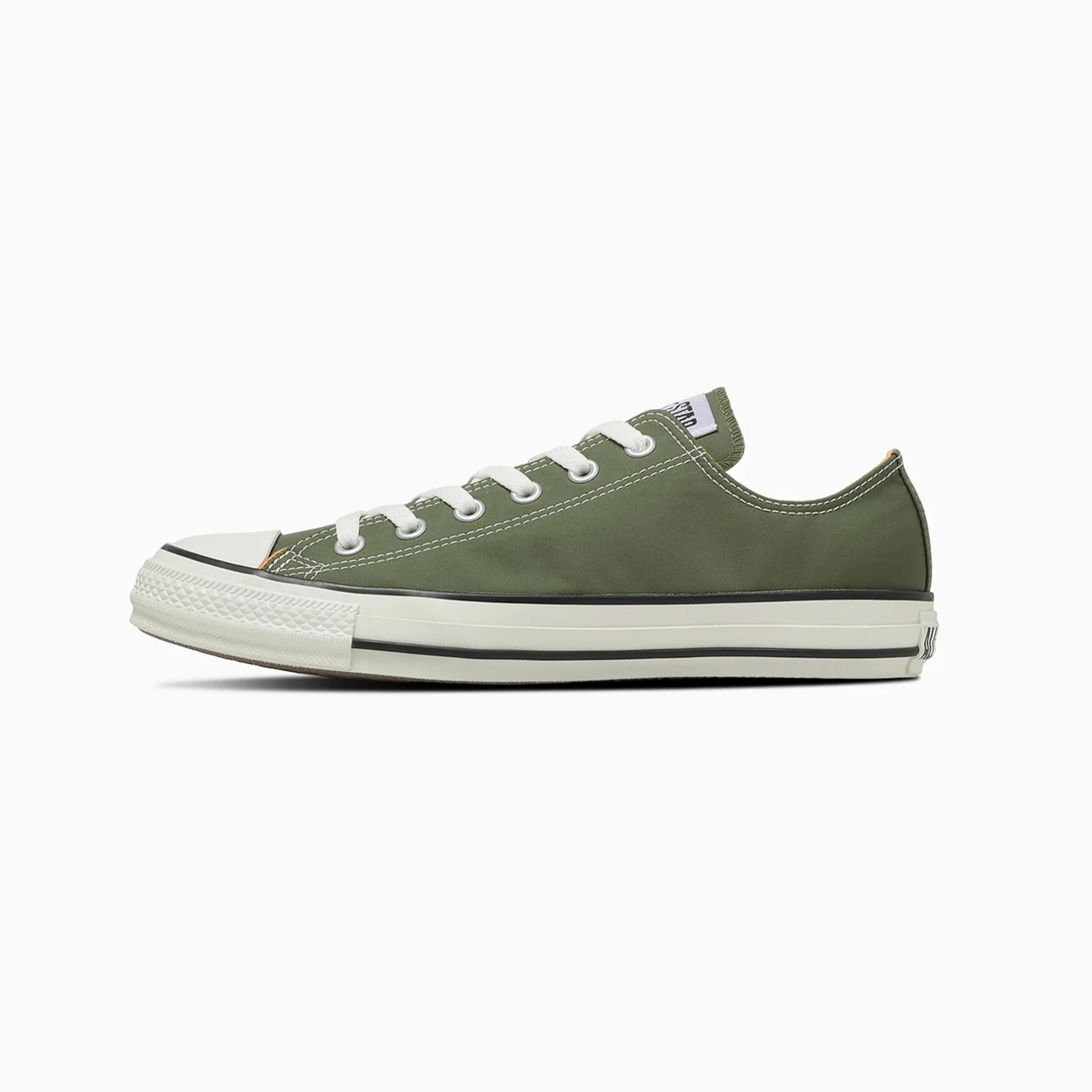 Low-top olive green canvas sneaker with white laces and rubber sole.