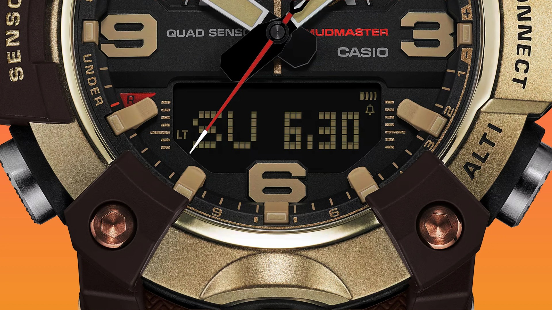 Close-up of a Casio Mudmaster watch face with gold-tone numerals, black dial, and digital display showing "SU 6.30".