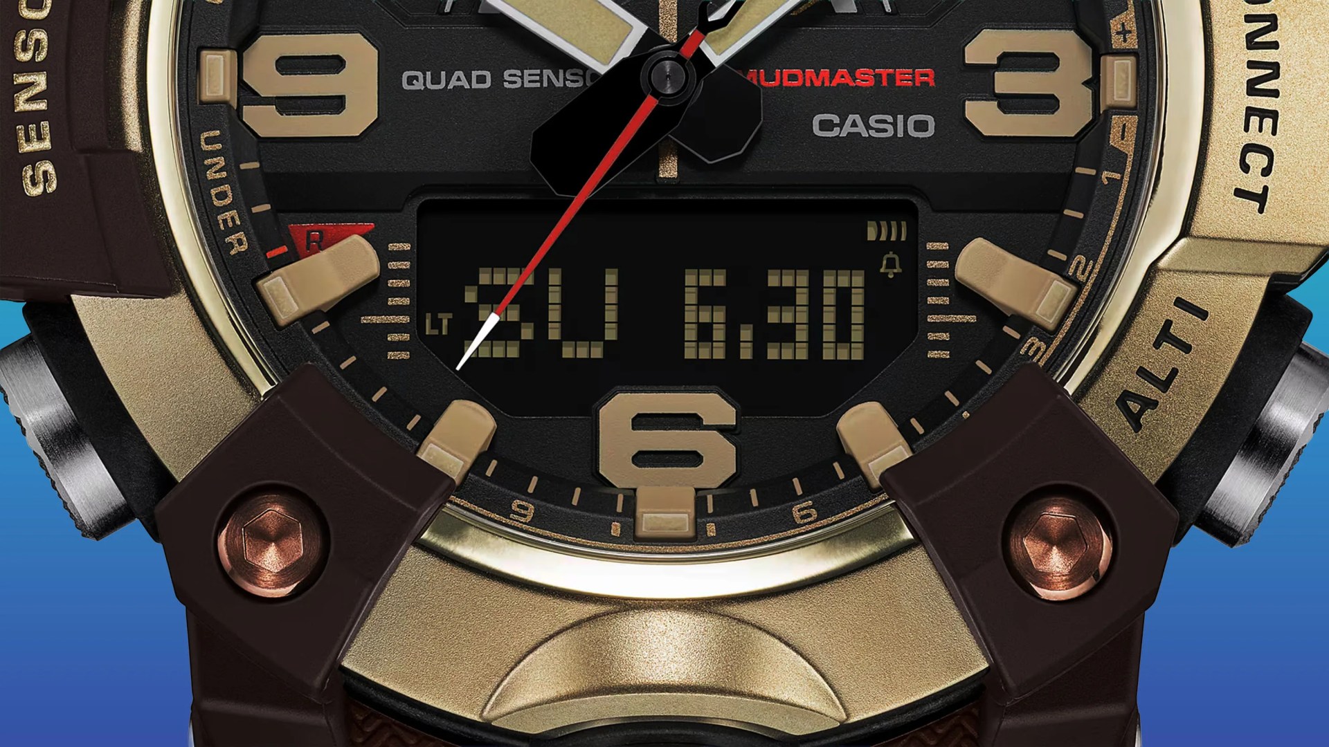 Close-up of a Casio Mudmaster watch face with gold-tone numerals, black dial, and digital display showing "SU 6.30".