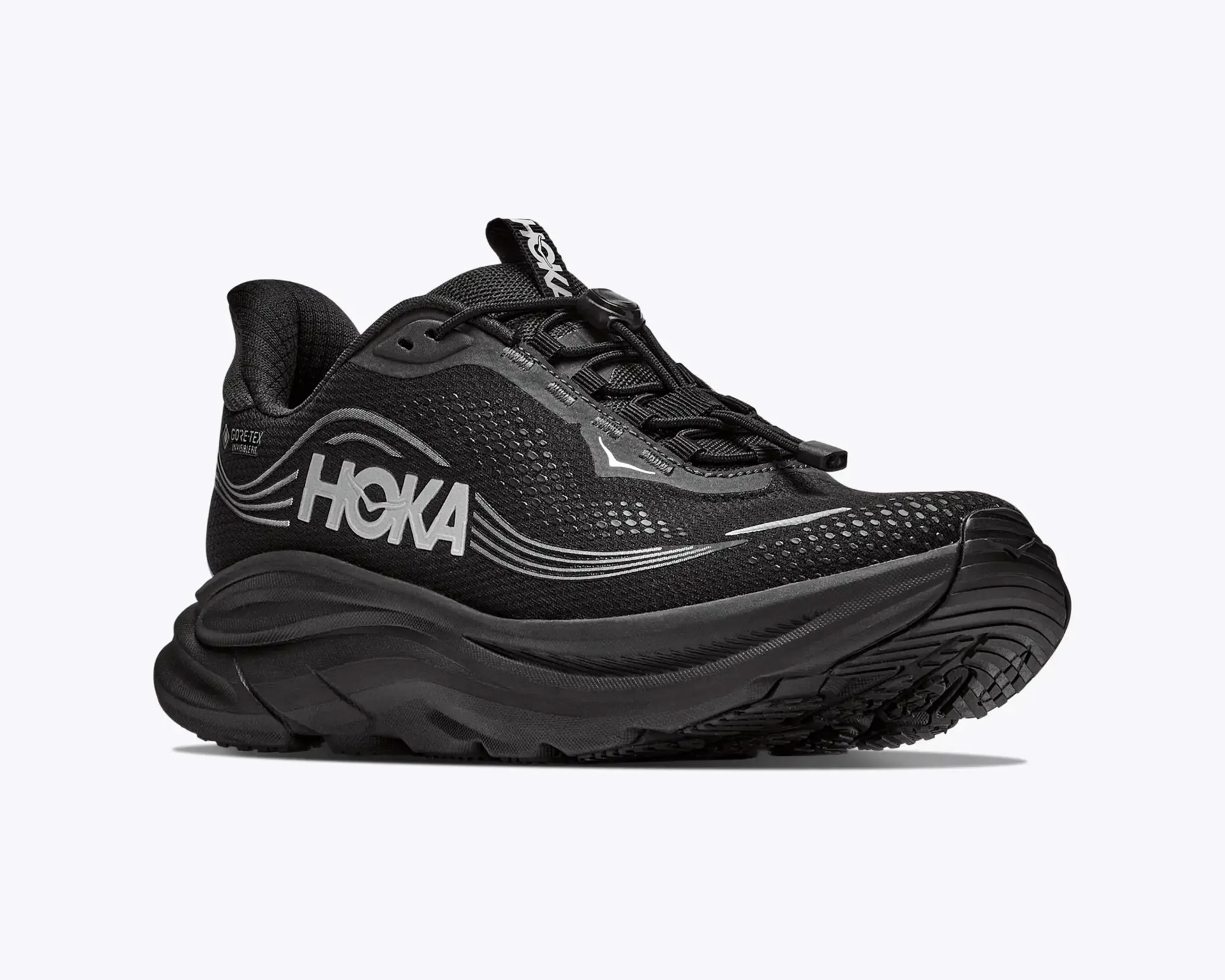Black Hoka running shoe with thick sole, reflective silver logo and accents, and toggle lace closure.