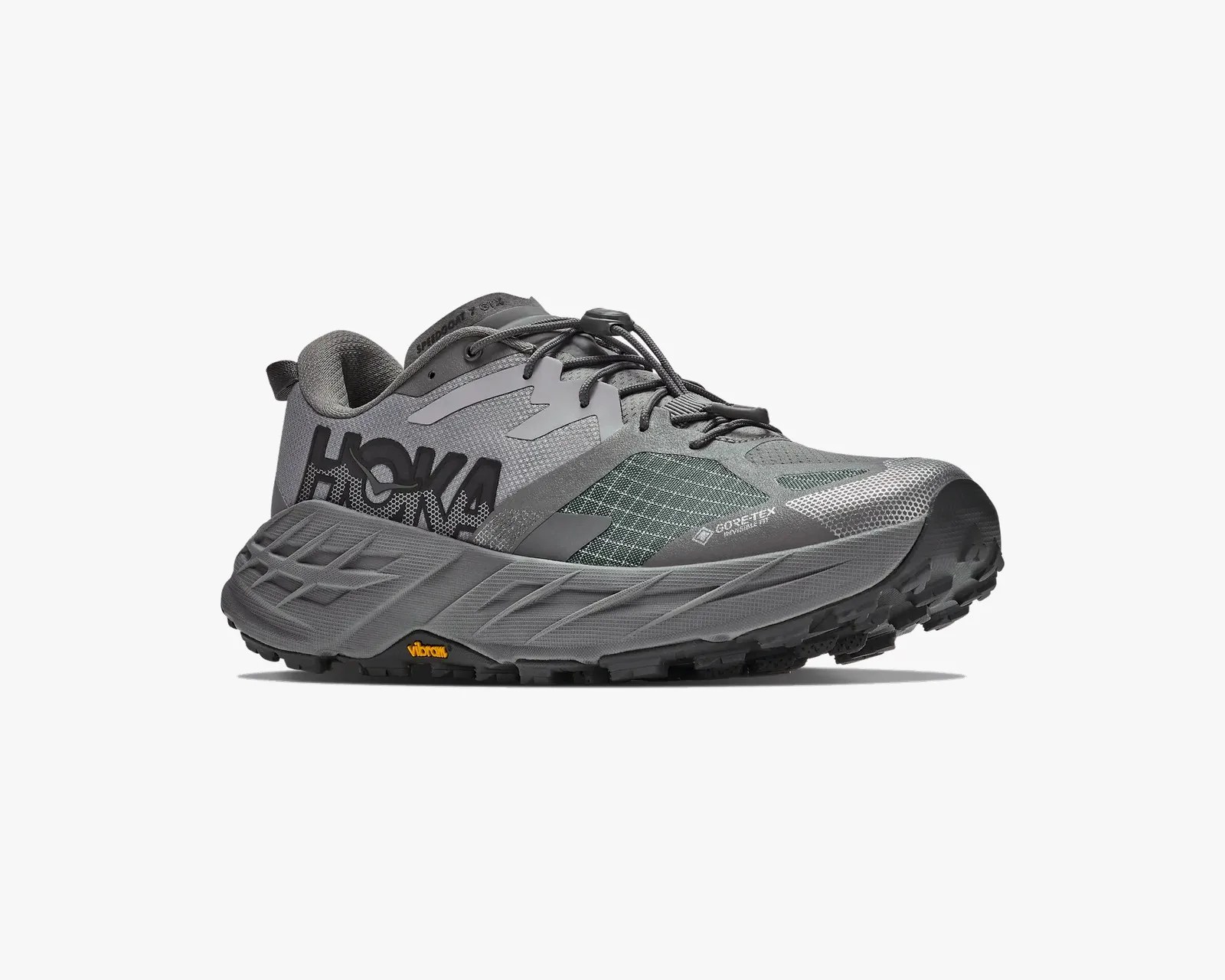 Gray Hoka trail running shoe with Gore-Tex Invisible Fit and Vibram sole, side view.