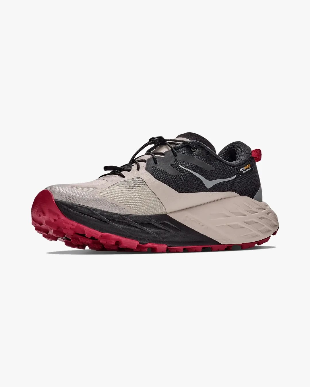 Beige, black, and red trail running shoe with thick sole and black laces on a white background.