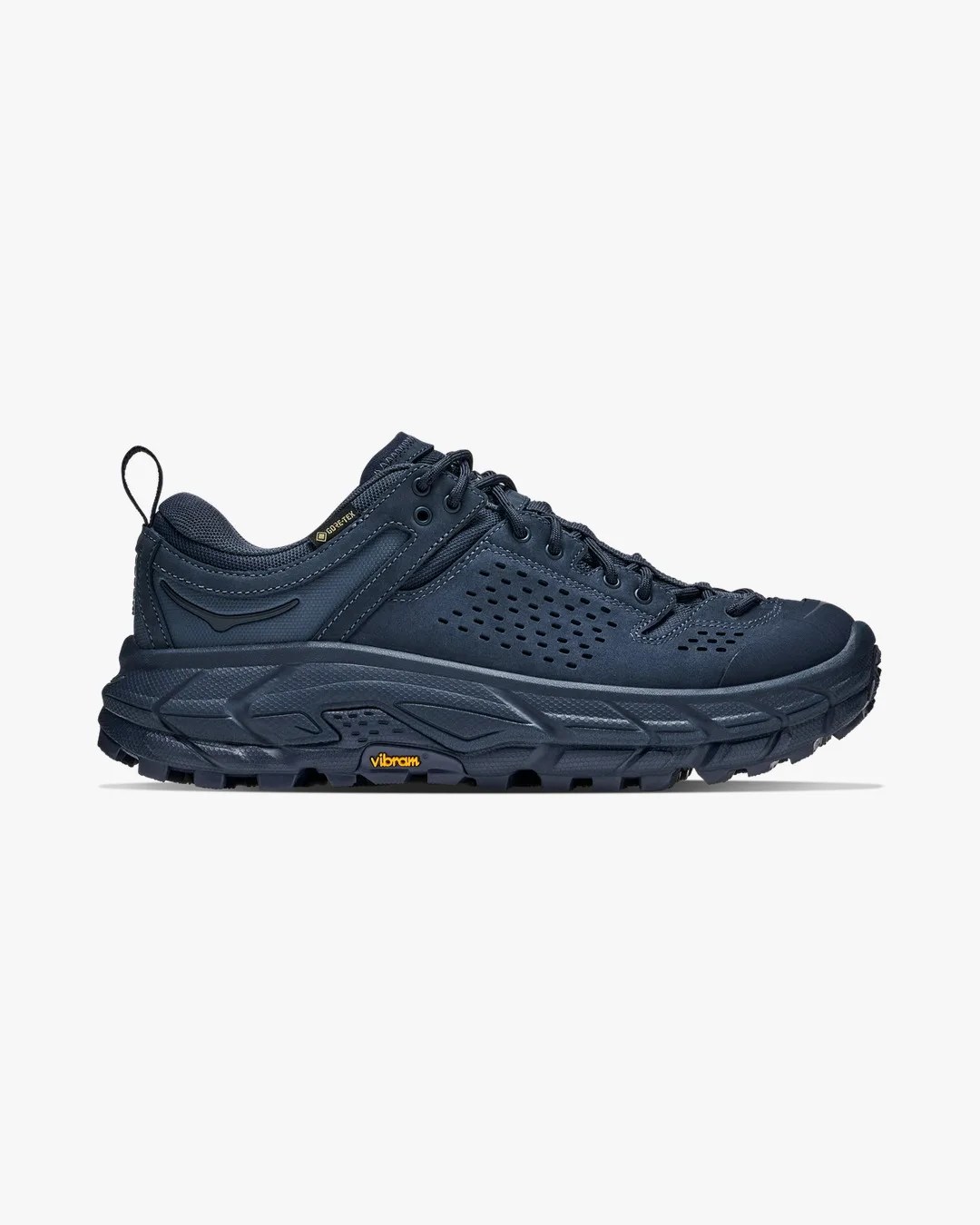 Navy blue Gore-Tex hiking shoe with perforated upper and Vibram sole, side view.