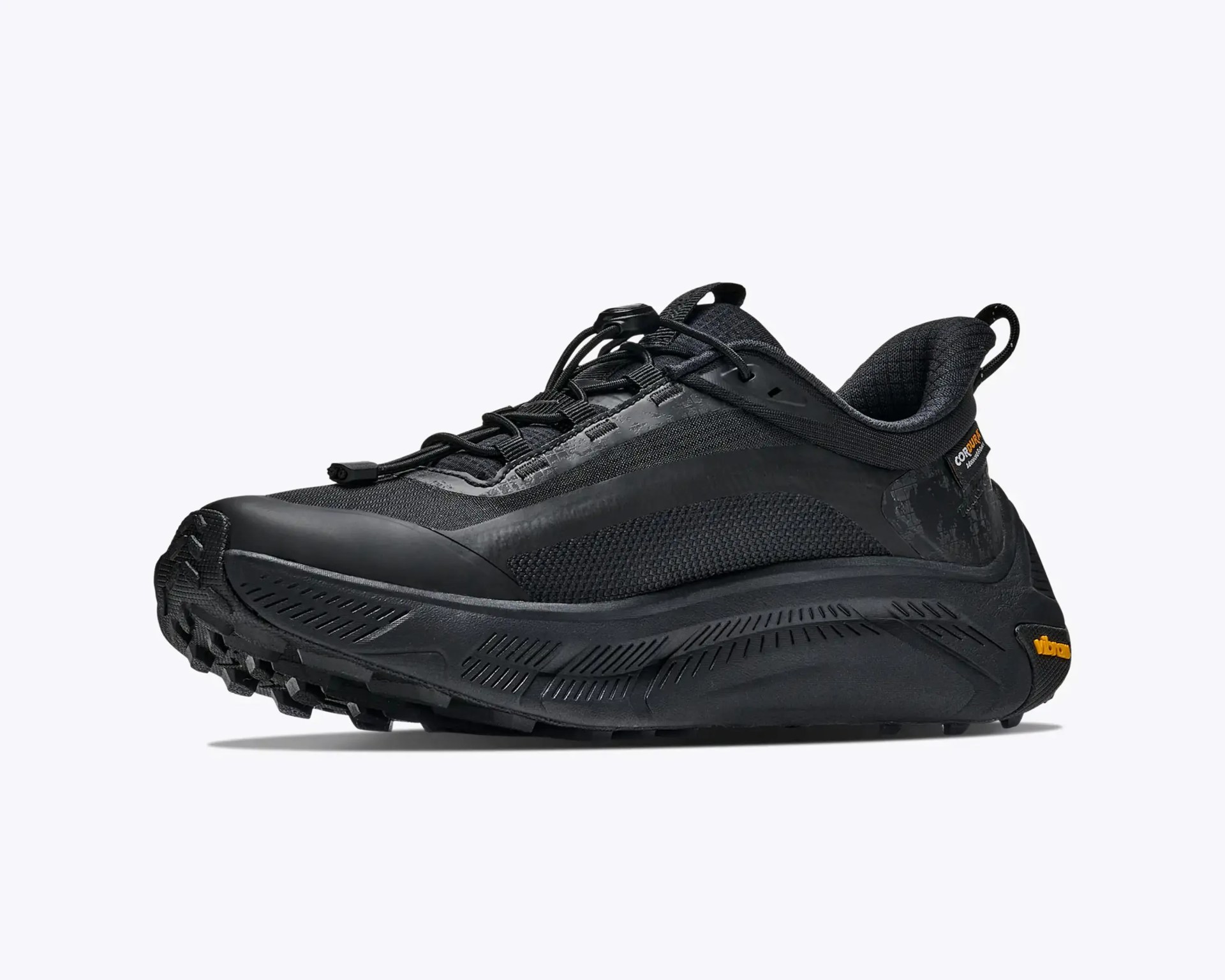 Black athletic shoe with textured mesh upper, thick sole, and quick-lace system on a white background.