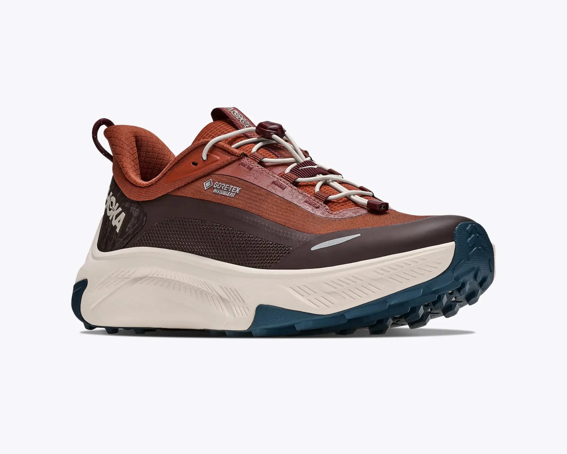 Brown and dark brown Gore-Tex trail running shoe with white sole and blue tread.