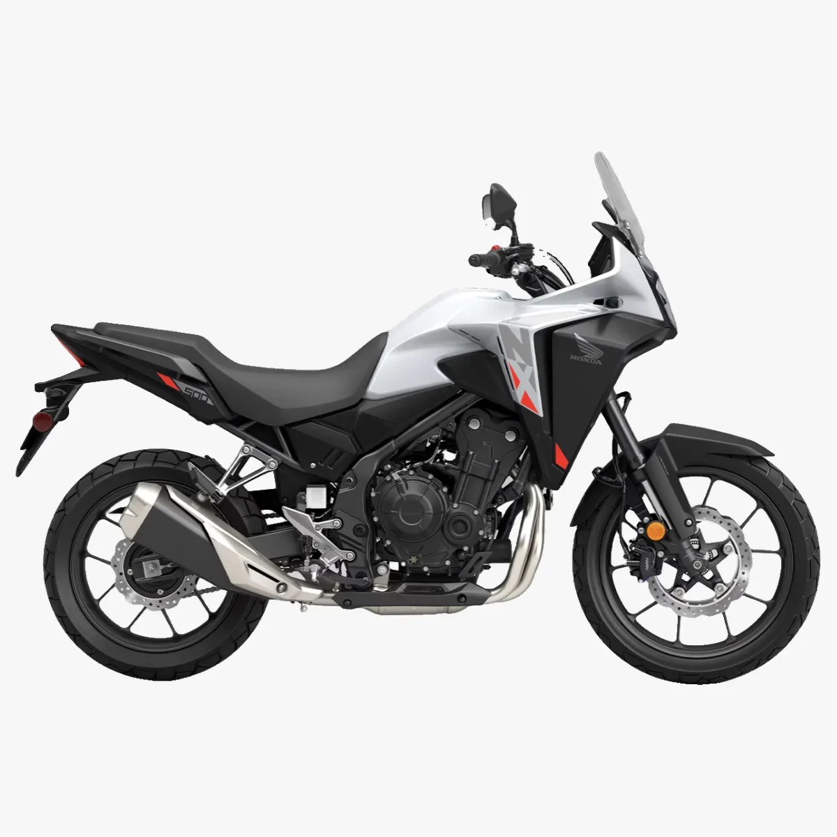 White and black Honda adventure motorcycle with red accents and a tall windshield.