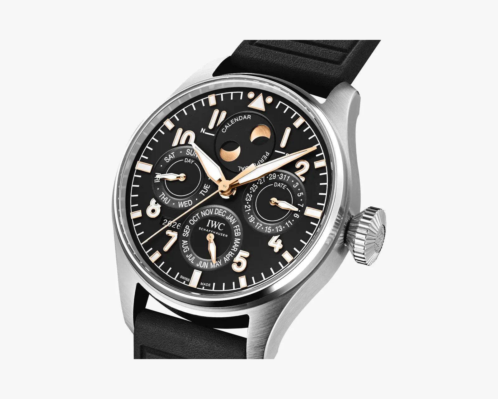Close-up of IWC Schaffhausen watch with black dial, gold-tone hands and markers, moon phase, day, date, month, and year indicators, and black strap.