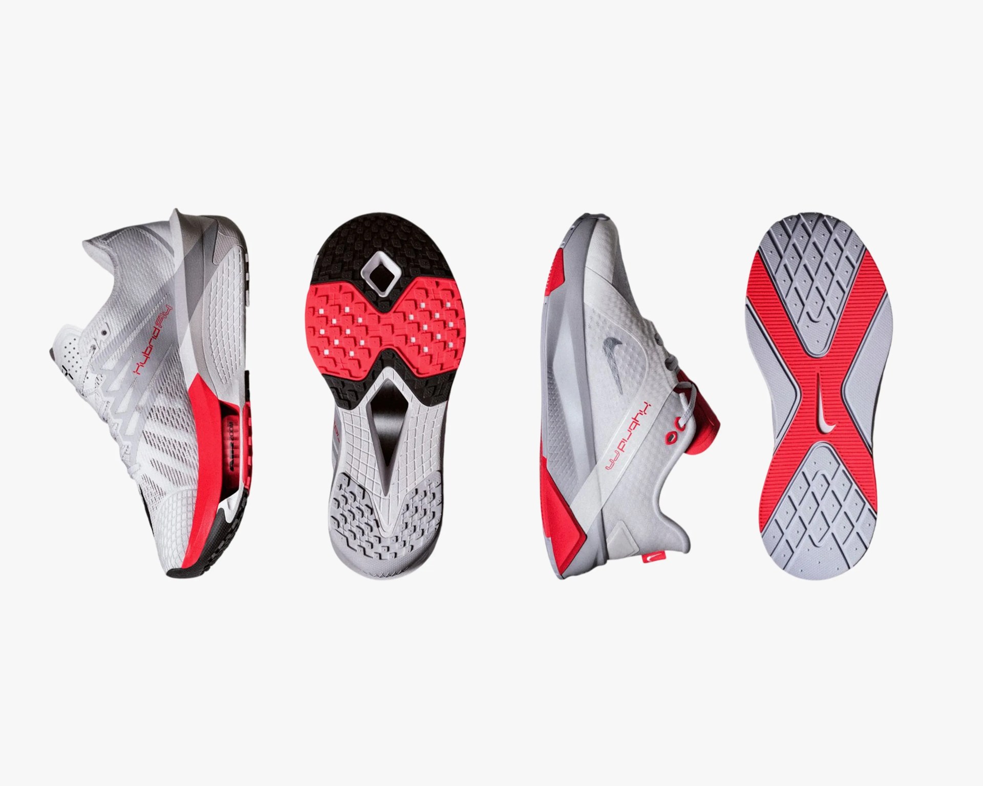 Pair of white and red Nike running shoes showing side and sole views.