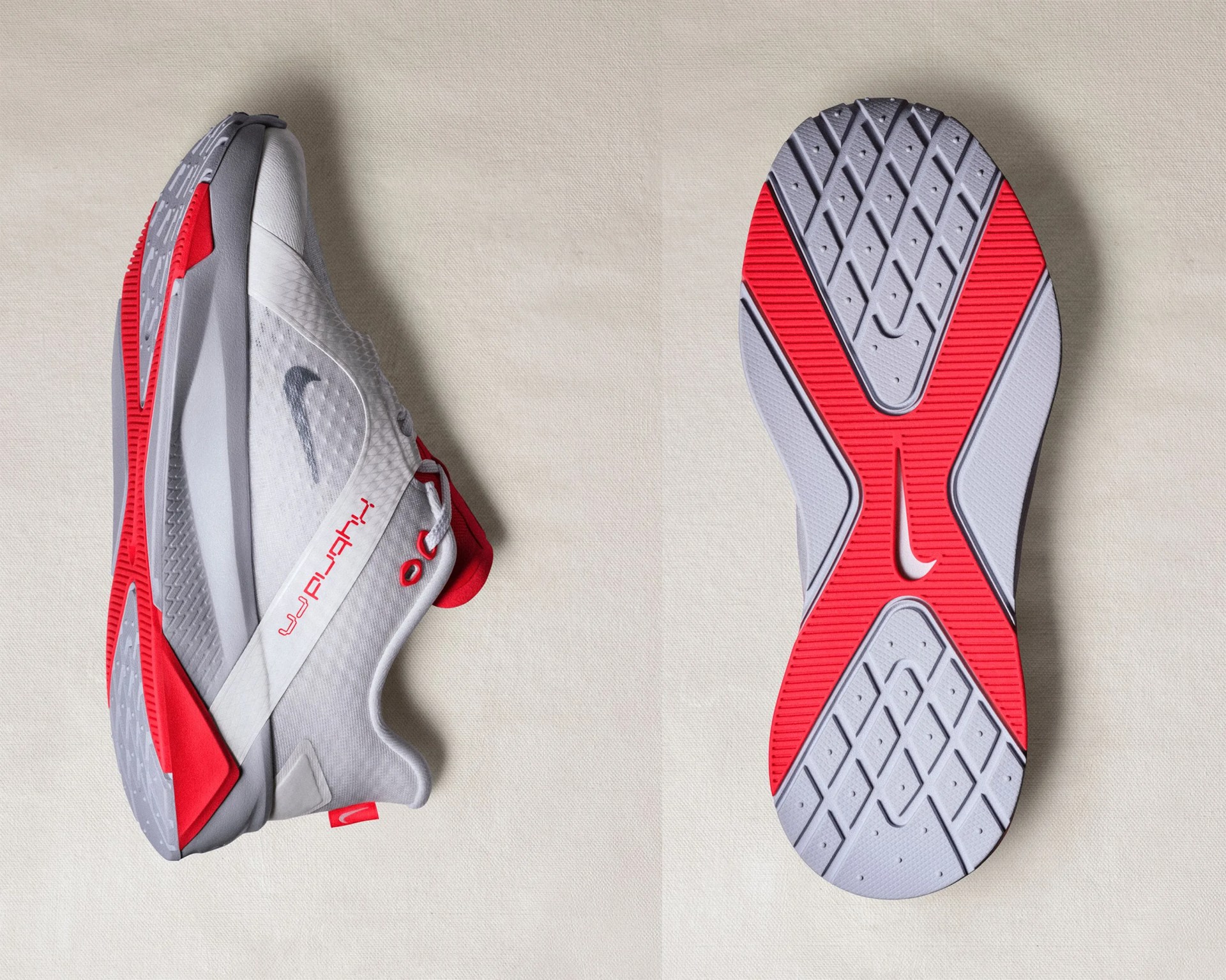 Pair of white and red Nike running shoes, one showing side view and the other showing sole with red and gray tread pattern.