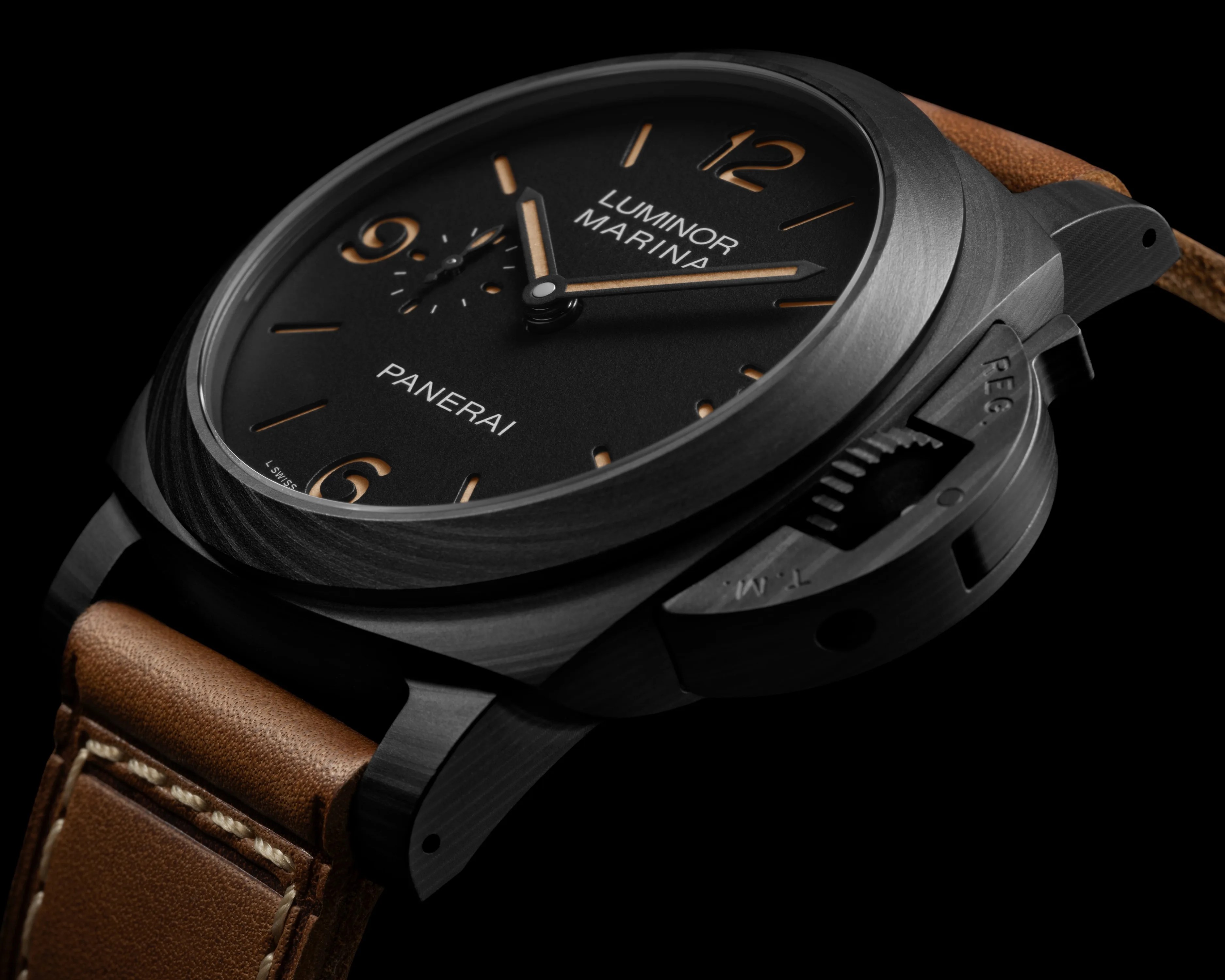 Black Panerai Luminor Marina watch with tan leather strap and brushed metal case on black background.