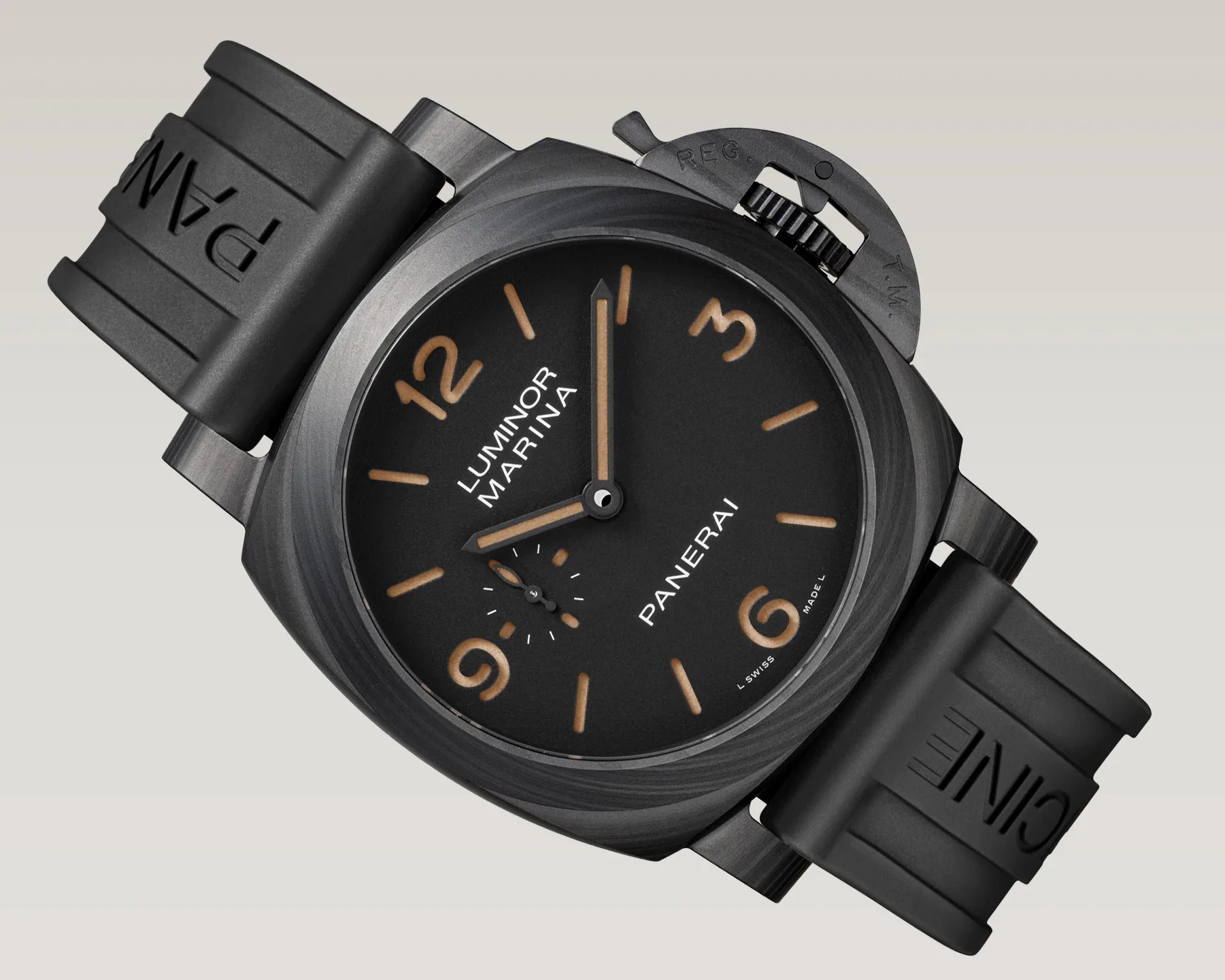 Black Panerai Luminor Marina watch with tan numerals and black rubber strap embossed with "PANERAI".