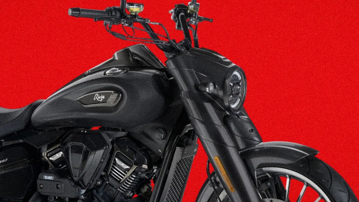 Black cruiser-style motorcycle front and side view against a red background.