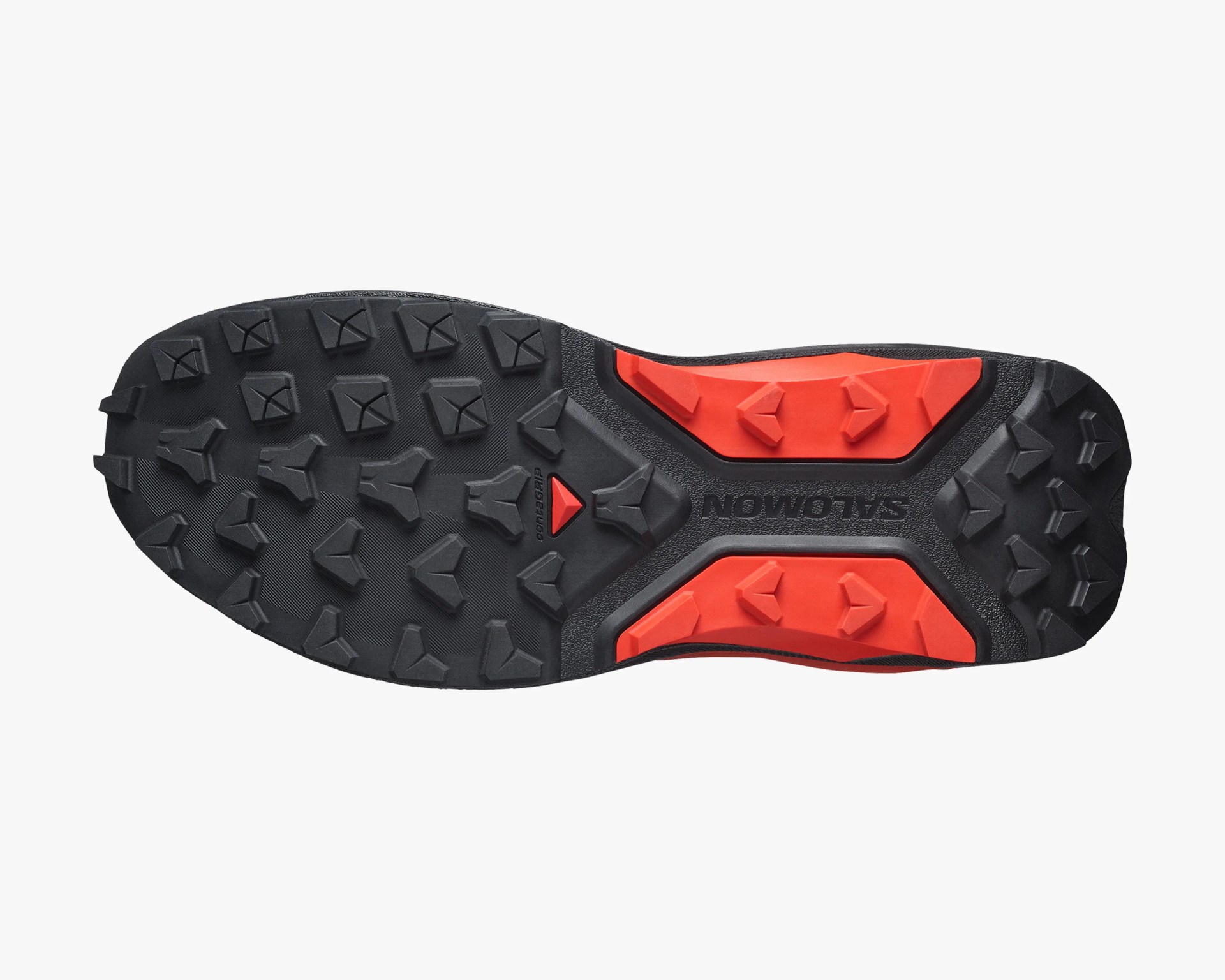 Black and red Salomon shoe sole with aggressive multi-directional lugs for traction.