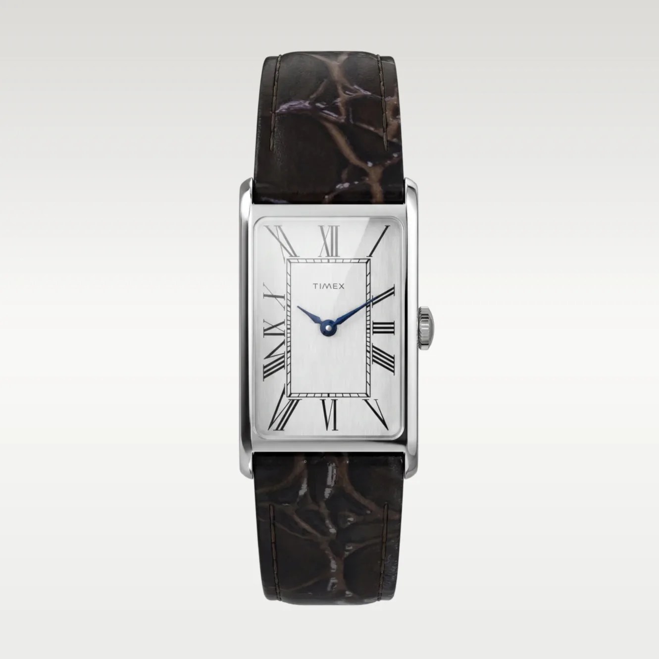 Rectangular silver Timex watch with white dial, black Roman numerals, blue hands, and dark brown leather strap.