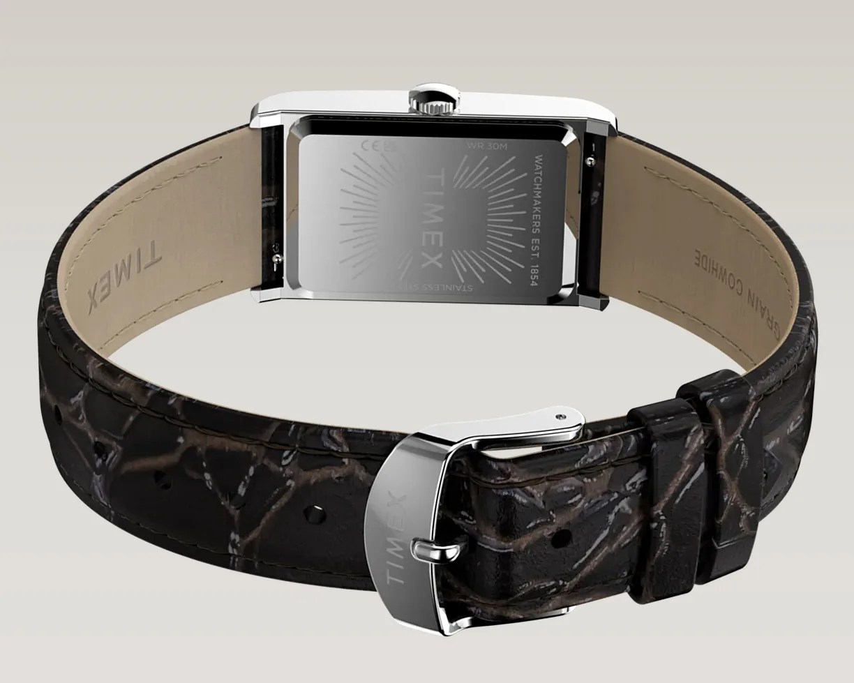Rectangular silver watch case with engraved back and black crocodile-pattern leather strap with silver buckle.
