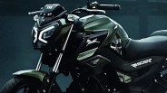 Close-up of a black and green motorcycle with "Raider" branding on the side panel.
