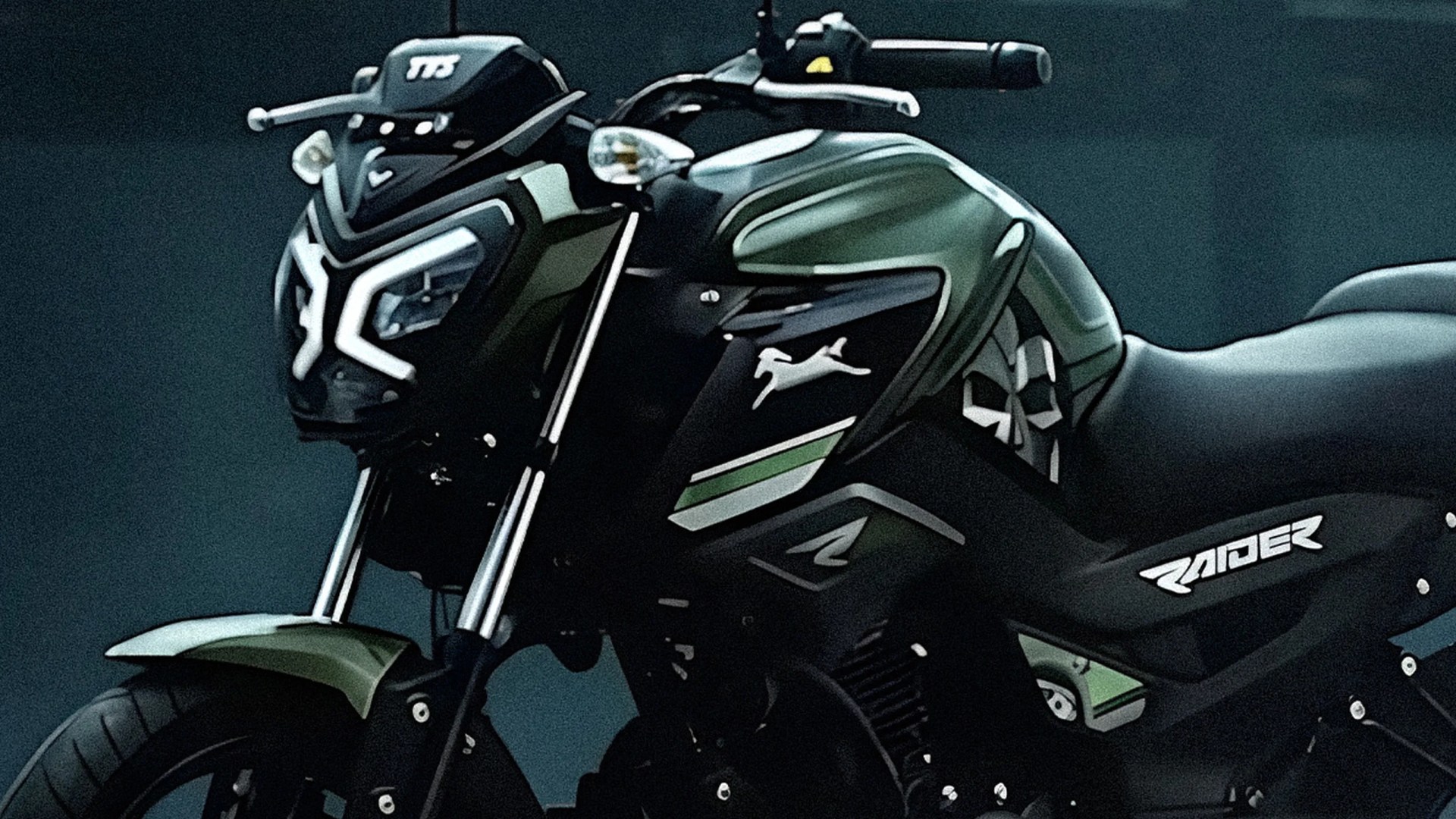 Close-up of a black and green motorcycle with "Raider" branding on the side panel.