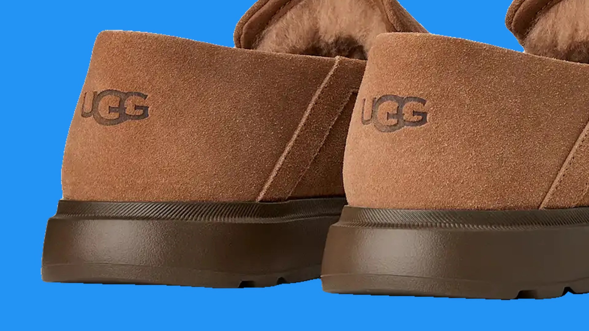 Pair of brown suede UGG shoes with dark brown rubber soles shown from the back.
