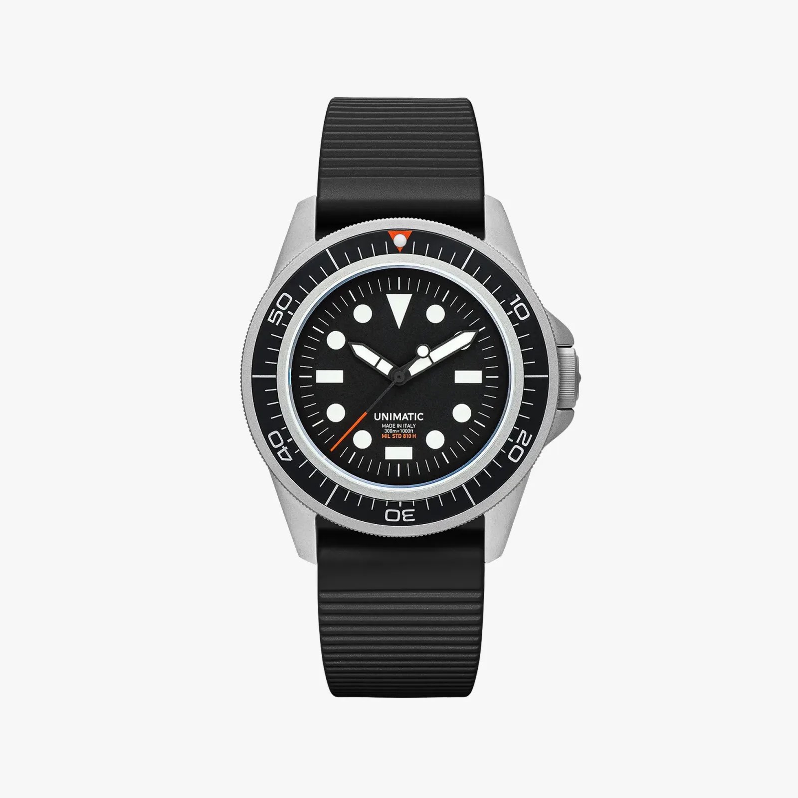 Black dial dive watch with white markers, silver case, black bezel, and black ribbed rubber strap.