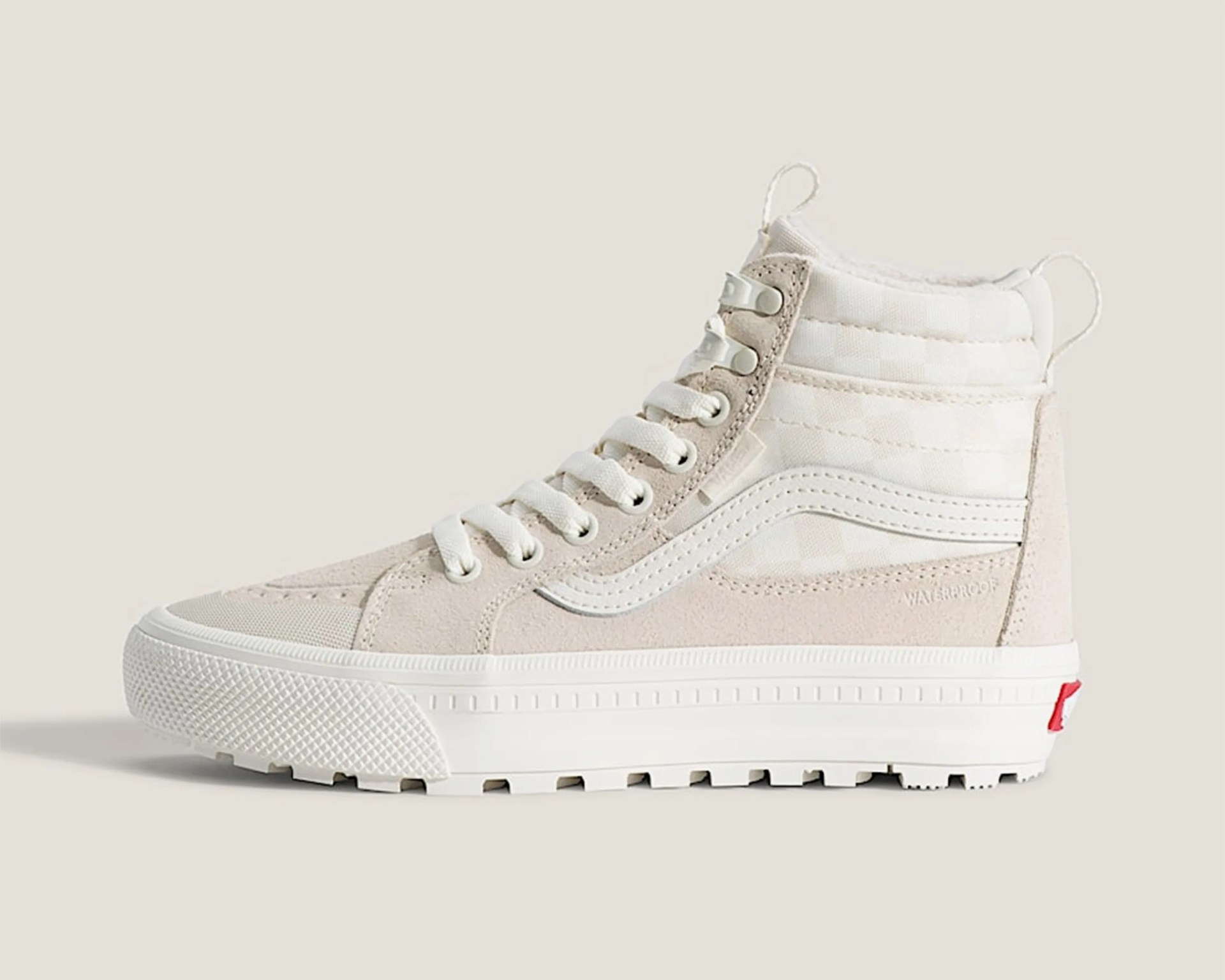 High-top beige and white sneaker with white laces, textured sole, and "WATERPROOF" text on the side.
