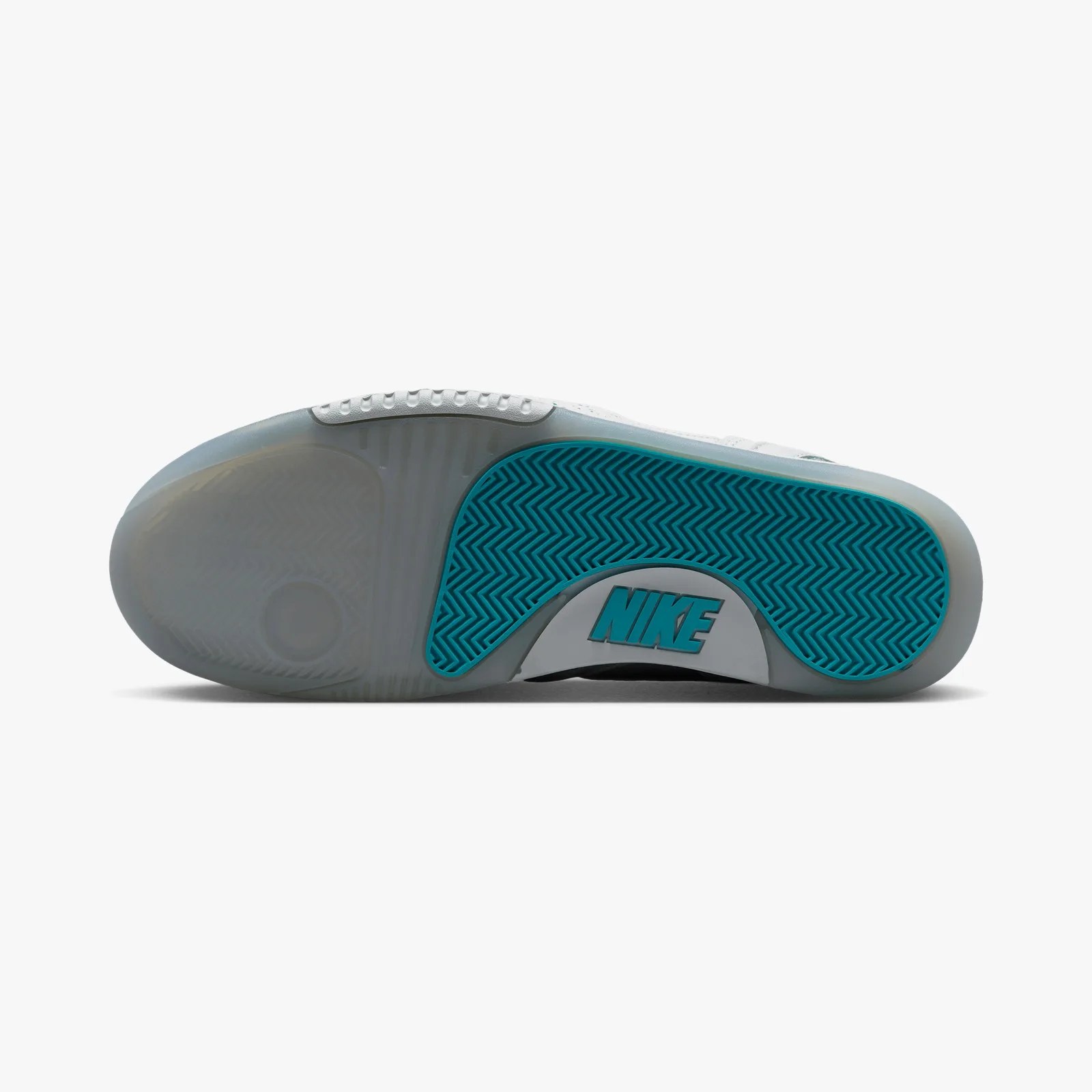 Sole of a white Nike sneaker with translucent rubber and turquoise herringbone traction pattern.