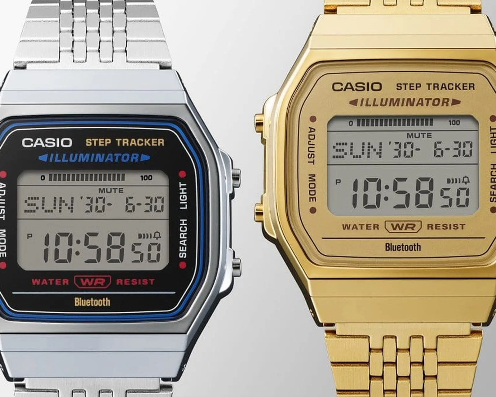 Two Casio digital watches side by side, one silver with blue accents and one gold, both showing time 10:58:50 and date SUN 30-6-30.