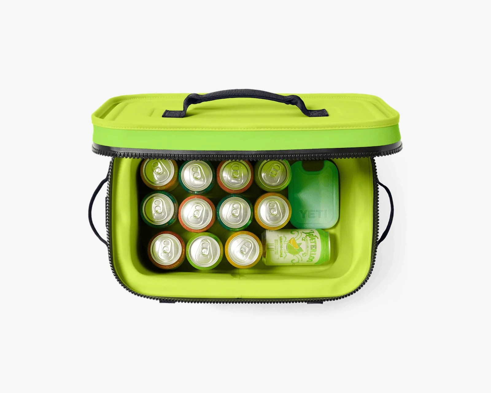 Bright green soft cooler bag with black zipper and handle, holding twelve beverage cans and a green ice pack inside.